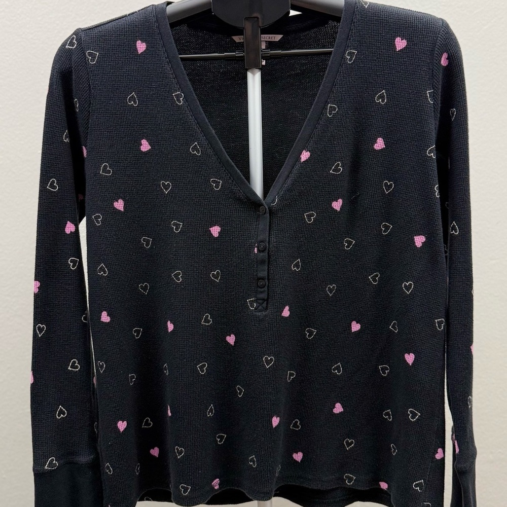 Cozy Victoria’s Secret waffle knit henley top with an allover heart print.